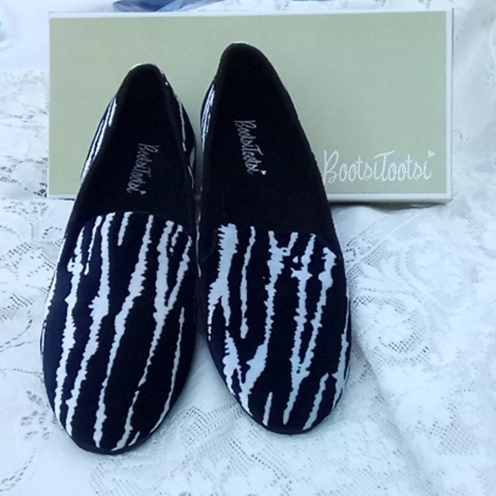 Bootsi Tootsie zebra pattern slippers.